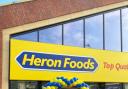 Heron Foods cutting the ribbon to open the store