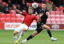 Will Forrester challenges for the ball in Wanderers' 2-1 pre-season win at Salford