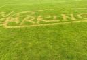 The vandalism at Turton FC's football pitch. It reads 'No Parking'