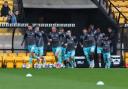 Bolton Wanderers players come out for the warm up at Port Vale