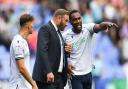 Cameron Jerome talks to Ian Evatt during the game against Derby County