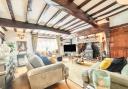 Wooden exposed beams add character to the lounge