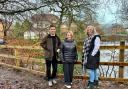 From left to right: Cllr Nadim Muslim,  Cllr Amy Cowen, and Cllr Samantha Connor with the new fencing around the fishing lodge
