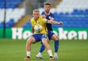 Joe Taylor is action for Colchester United against Cardiff City earlier this season