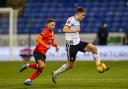 George Thomason drives past Luton's Jordan Clark in the FA Cup replay on Tuesday night