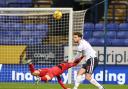 Jack Iredale clears under pressure in Wanderers' 1-0 win against Cheltenham