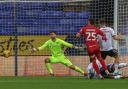 Nathan Baxter watches a late effort from Josh Harrop go wide in Wanderers' 1-0 win against Cheltenham