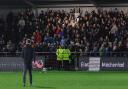 Ian Evatt applauds the supporters after a game at Fleetwood in late December