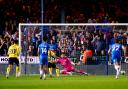 Cameron Brannagan scores from the penalty spot at Peterborough in the semi-final