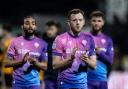 George Johnston applauds the travelling fans at Cambridge on Tuesday night.