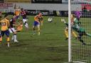 Arthur Gnahoua curls in a dramatic late winner for Wanderers in League Two on their last visit to Mansfield.