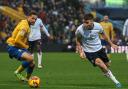 Thomason drives with the ball