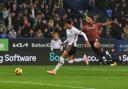 Bolton Wanderers' Mason Burstow runs with the ball chased by Bradford City's Ibou Touray