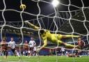 Bolton Wanderers' Ibrahim Cissoko (right) scores his side's second goal despite the attentions of Bradford City's Sam Walker