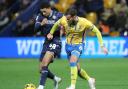 Mason Burstow battles for possession