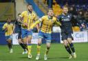 Sam Dalby wrestles with his marker in Wanderers' 1-0 win at Mansfield Town