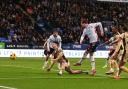 Bolton Wanderers' Max Conway shoots for goal under pressure from Rotherham United's Joe Powell
