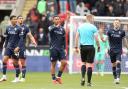 Bolton Wanderers players remonstrate with referee James Oldham after Rotherham United opened the scoring