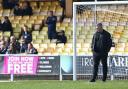 Steven Schumacher takes a look at the Port Vale pitch before Saturday's game