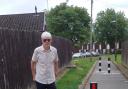Cllr Derek Bullock next to the newly-installed bollards