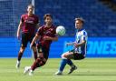 Bolton Wanderers' Josh Sheehan passes the ball under pressure from Sheffield Wednesday's Jarvis Thornton