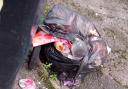 Black bags remained after residents say they were told excess waste would be collected