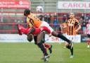 LET'S GET PHYSICAL: Robust challenges from the Altrincham v Barnet game last Saturday