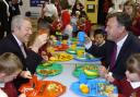 Alan Johnson, left, and Ed Balls join youngsters for dinner at Queensbridge Primary School in Farnworth