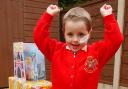 Megan Sale at home in Daisy Hill with cards and presents for her fourth birthday