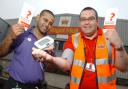 Post office worker Michael Barnes, right, has his blood pressure checked by NHS trainer Jay Ahmed