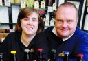 BOTTLED RANGE: Staff member Jennifer Burrows and brewery owner Dave Sweeney