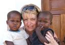 Mary Maguire with two Kenyan orphans