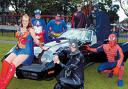 ON PARADE: Local villagers pose as superheroes at the annual fun day. From left, Wonder Woman (Clare Gore), Captain America (Stuart Philbin), Superman (Les Martin), Catwoman (Sharon Pearson), Robin (Lee Smith), Batman (David Cragg) and Spiderman (Michael