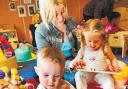 PLAY TIME: Amy Mulvaney with her children, Kayden and Lela, at the Orchards Children’s Centre in Farnworth