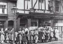 JOIN THE QUEUE: Young and old wait to get inside the Sabini Brothers cafe in Bolton’s during the 1930s