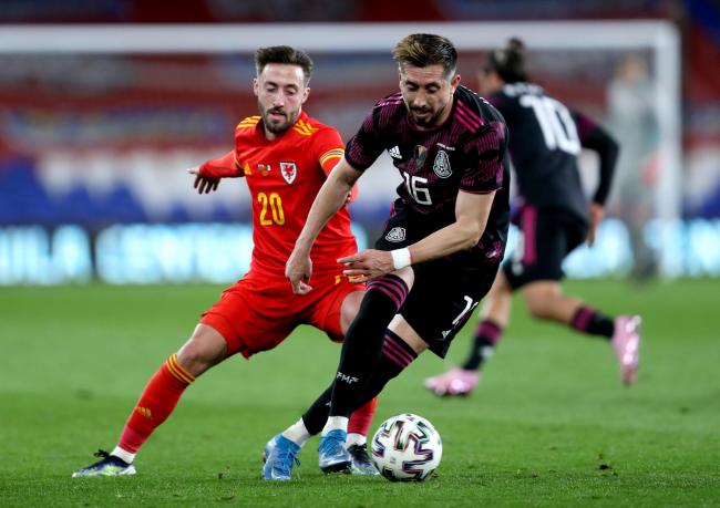 Josh Sheehan in action for Wales against Mexico