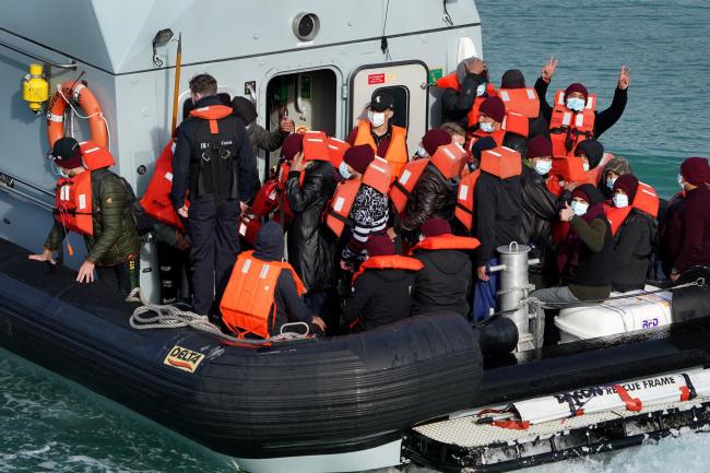 A group of people thought to be migrants are brought in to Dover by Border Force officers