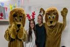 MANE MEETING: Volunteers from Bolton School, left, Alara Unsal and Megan Jones with two furry supporters of Bolton Lions including student Neerav Patel at the new Lions’ shop in The Market Place