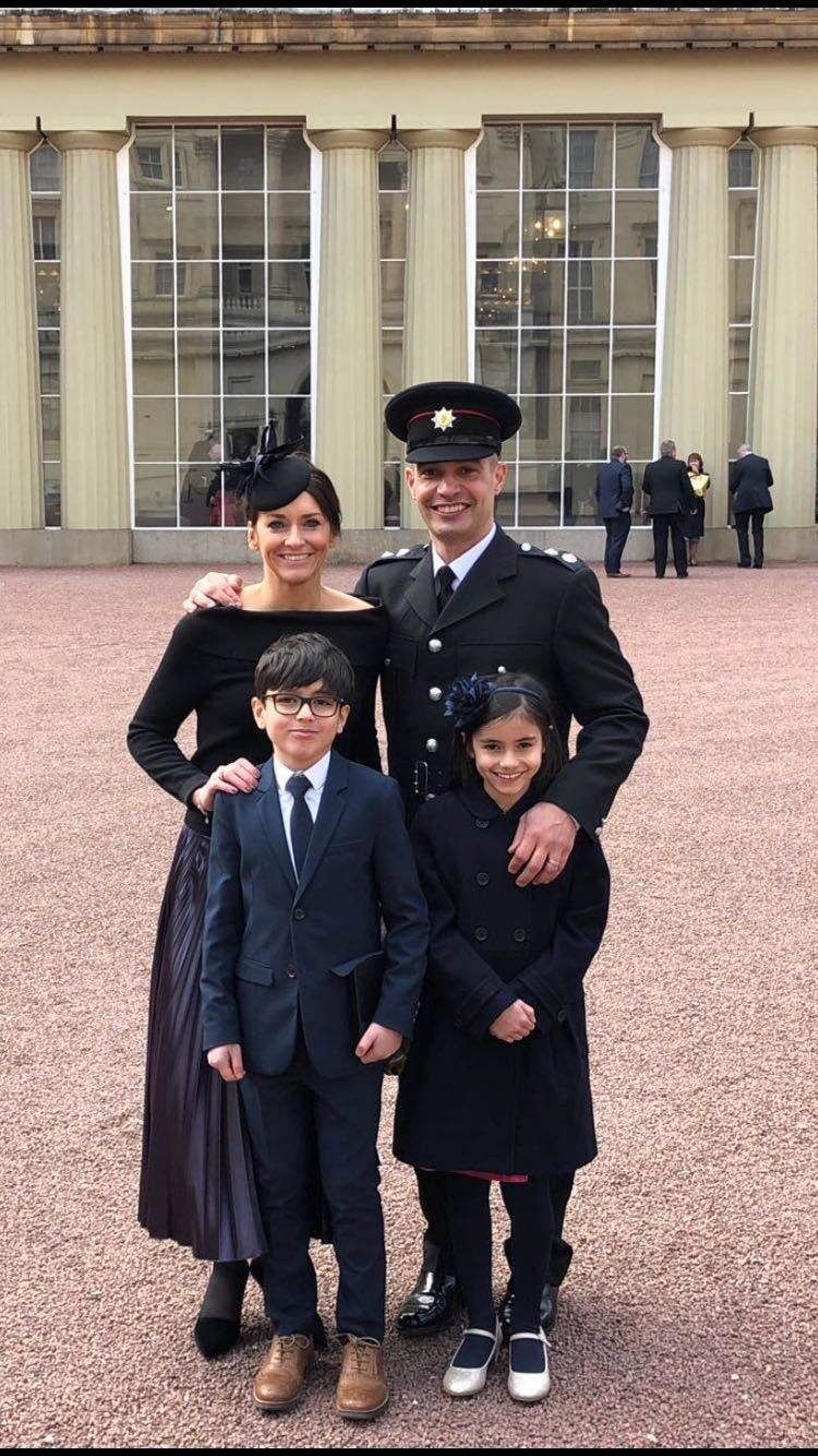 HONOUR: Watch Manager Simon Ryder with his wife Helen, son Joe and daughter Bella in the grounds of Buckingham Palace