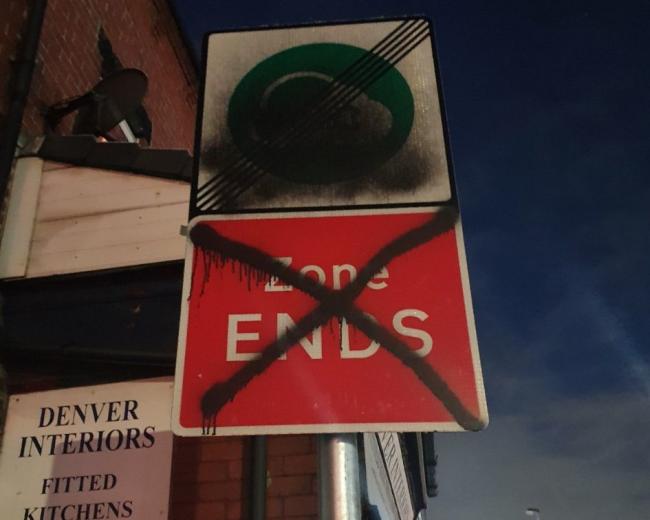 Vandalised: A Clean Air Zone sign in Kearsley has been painted over