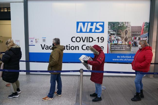 People queue to receive Covid-19 vaccinations