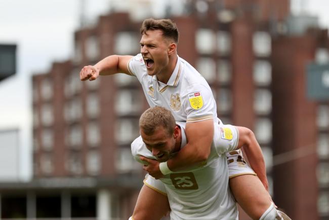 Dennis Politic celebrates a goal at Port Vale with James Wilson
