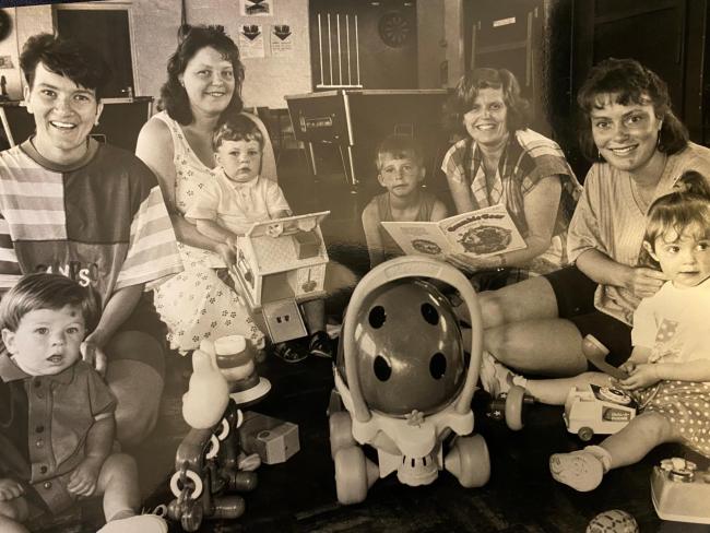 ALL SMILES: Young parents with their children at Farnworth Youth Club in 1993. Are you one of the people pictured, email robert.kelly@nqnw.co.uk
