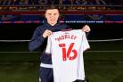 Aaron Morley poses with his new Bolton shirt. Picture courtesy of BWFC.