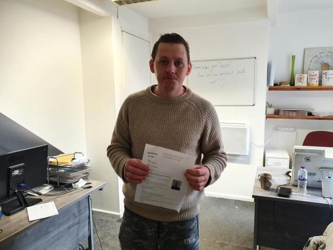 BATTLE: Andrejs Agurjanous with his certificate of application for settled immigration status