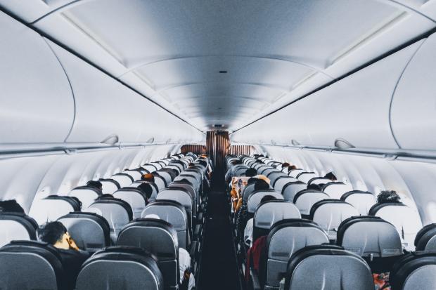 The Bolton News: Rows of empty seats on a plane. Credit: Canva