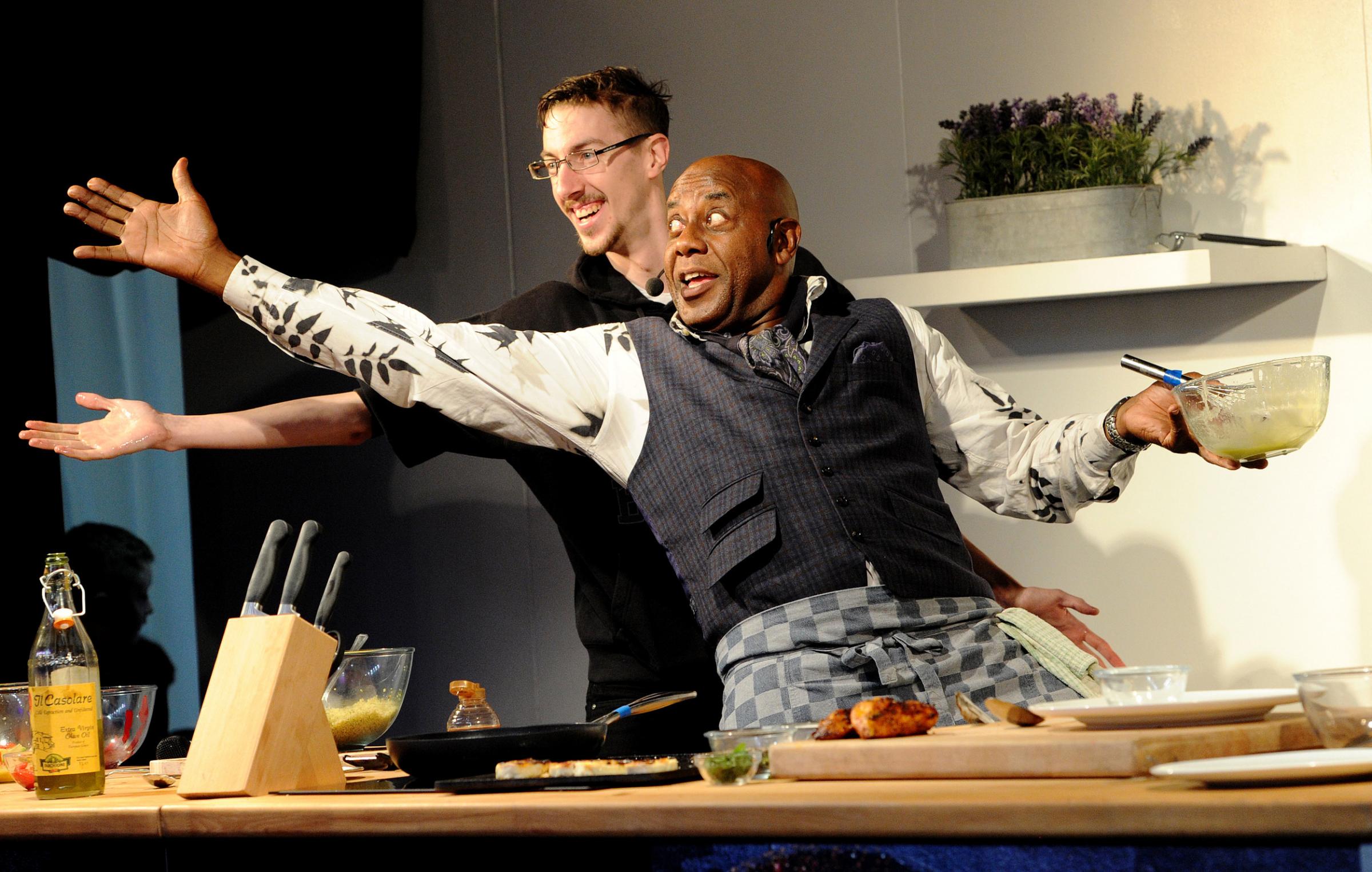 Day three of the annual Bolton Food and Drink Festival featured appearances from celebrity chefs Ainsley Harriott, Andrew Nutter and Simon Wood. Ainsley Harriott has fun during his demonstration with Bolton man Neil. Picture by Paul Heyes, Saturday