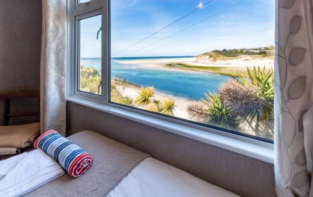 The Bolton News: Stunning absolute sea beachfront Beach House St Ives Bay. Credit: Vrbo