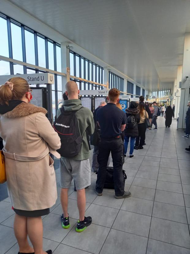 The Bolton News: A long line of customers waiting for the bus at Bolton Interchange 