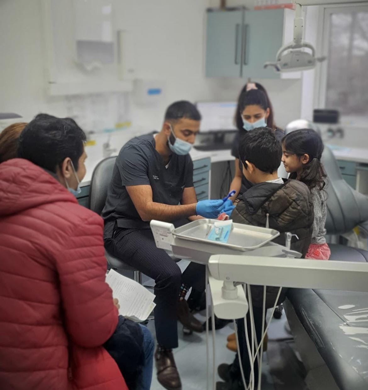Dr Naveed Patel shows refugee children the best dental hygiene methods